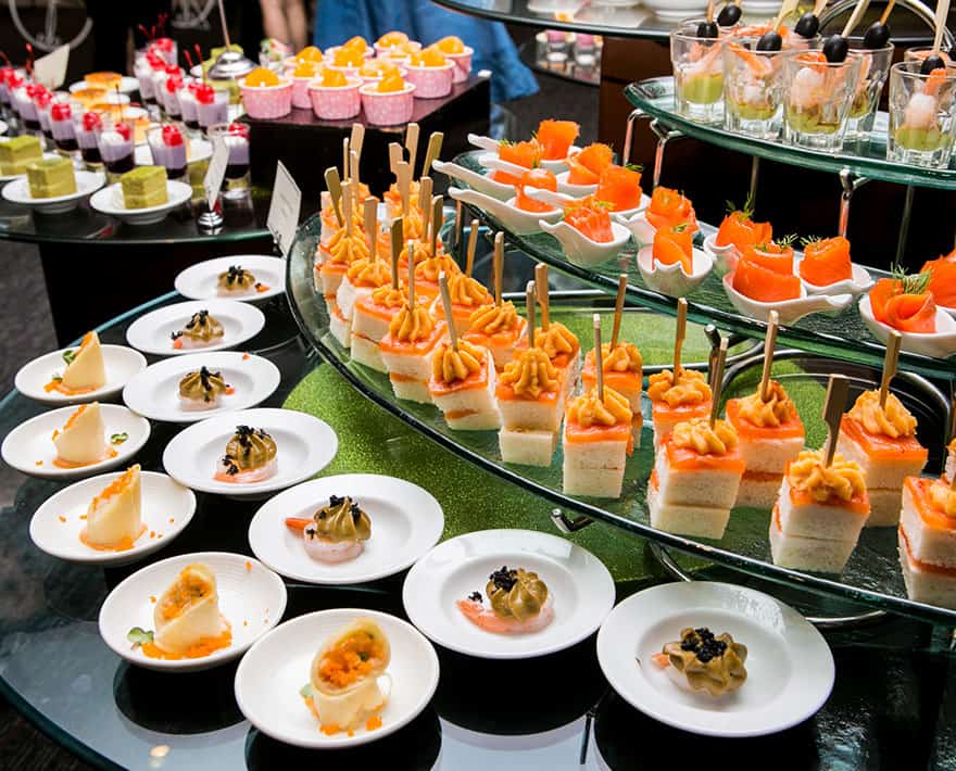 A tray of appetizers on a table at a corporate event.