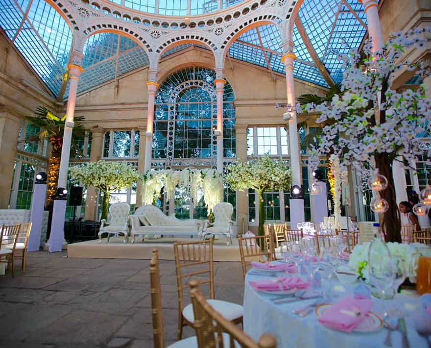 A wedding reception in a historic conservatory at Syon Park, London.